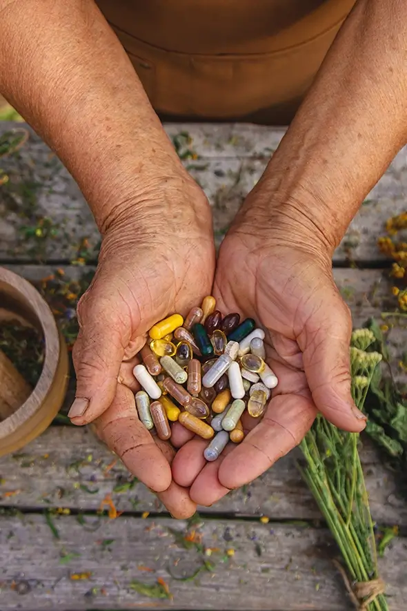 an-elderly-woman-holds-supplements-in-her-hands-s-2024-12-19-19-01-20-utc copy